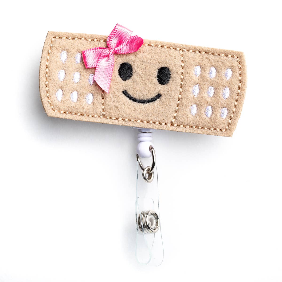 pink bow bandage badge reel